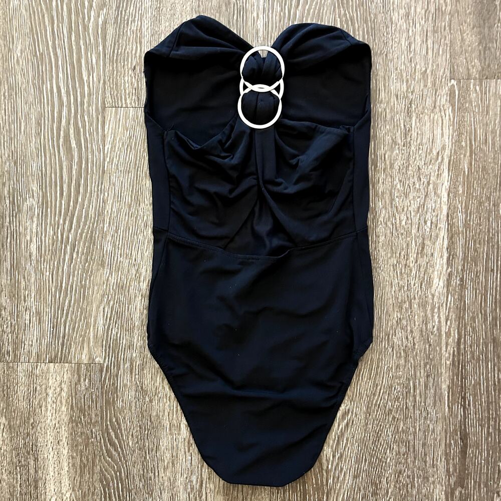 EUC Maje Black Bodysuit Size 1/ Small Silver Ring Hardware Criss Cross Back Chic